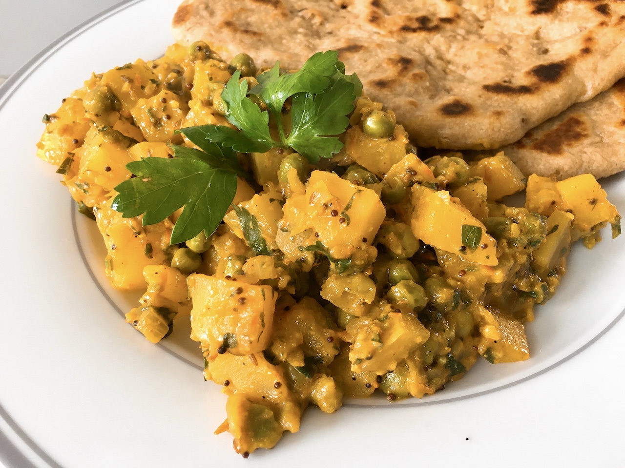 Indian Potato and Peas Curry (Bombay Aloo Matar)