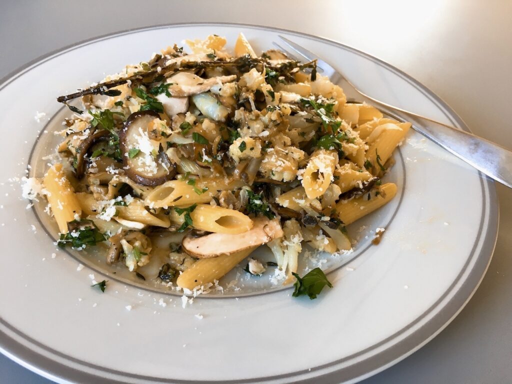 Vegetarian penne with cauliflower, mushroom and thyme.