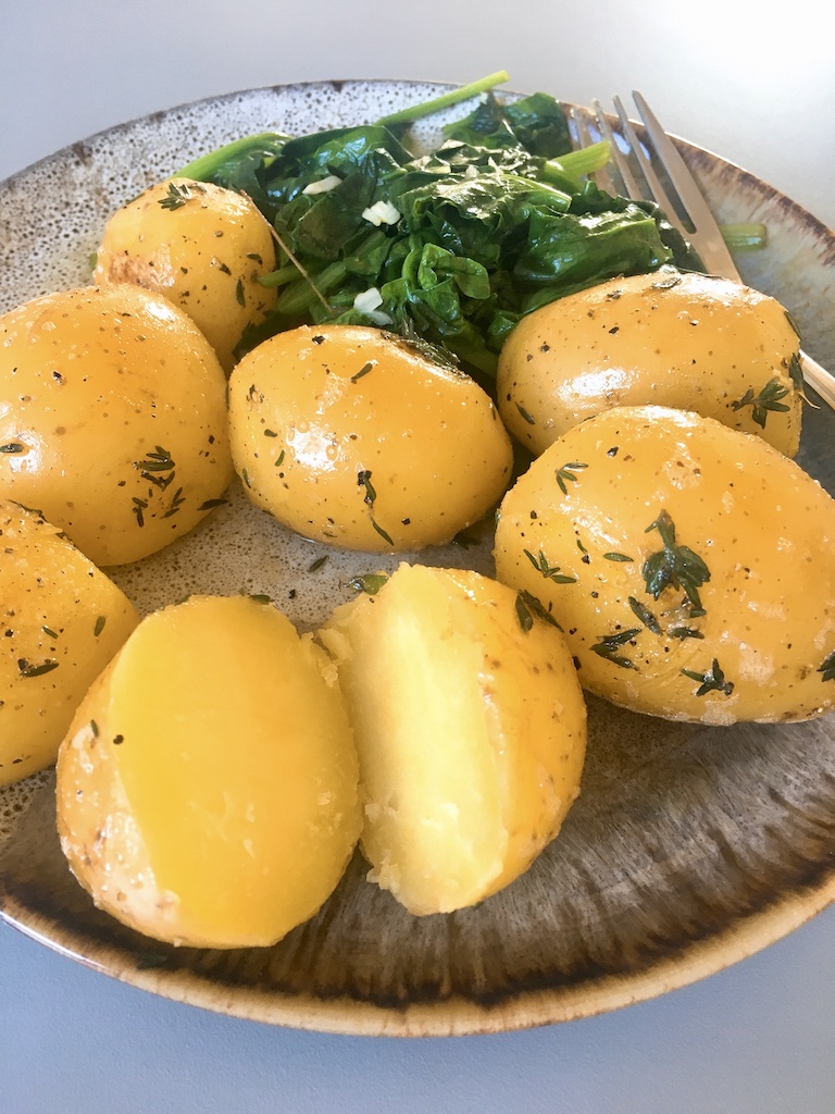 simple boiled potatoes with thyme, like a restaurant side dish.