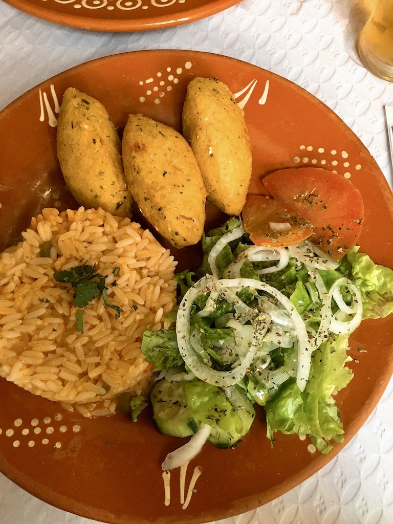 bacauhal croquette with tomato rice, a typical Portuguese dish.