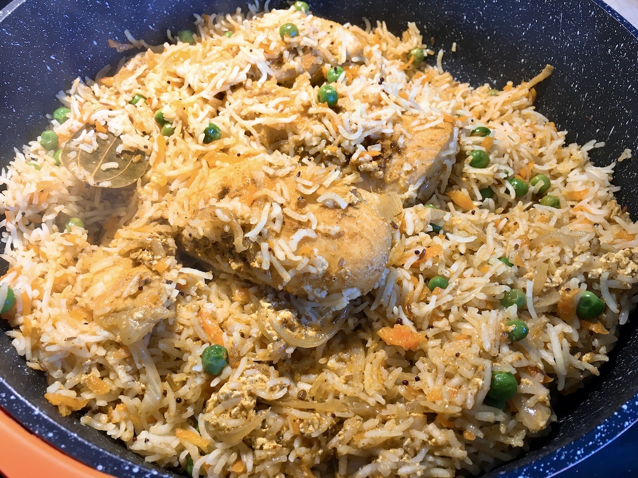 Fragrant fish biryani in a big pot.