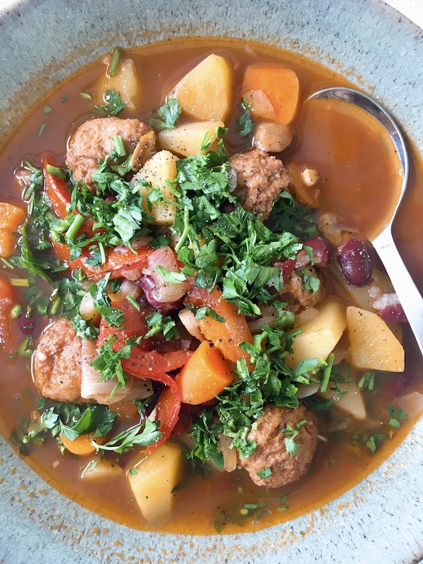 A bowl of kidney beans stew with IKEA meatballs.