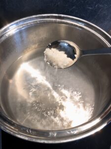 Salted water to cook pasta.