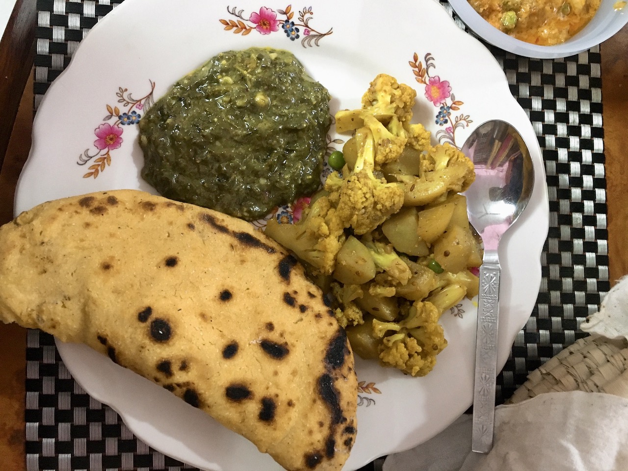 Makki ki roti paired with mustard leaves and cauliflower.