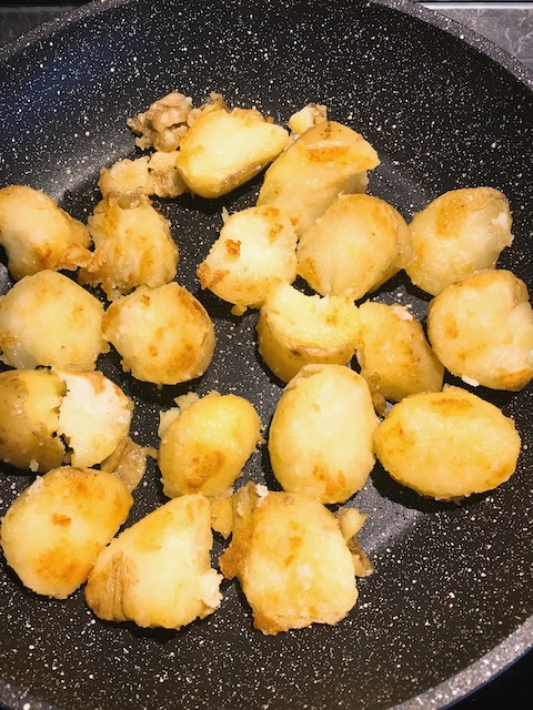 Pan-fry potatoes until golden.