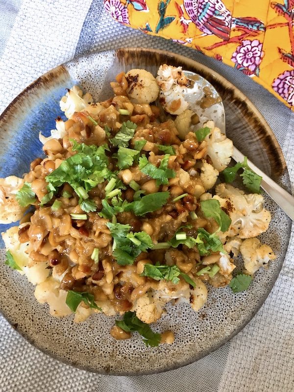 Roasted cauliflower with chunk satay sauce.