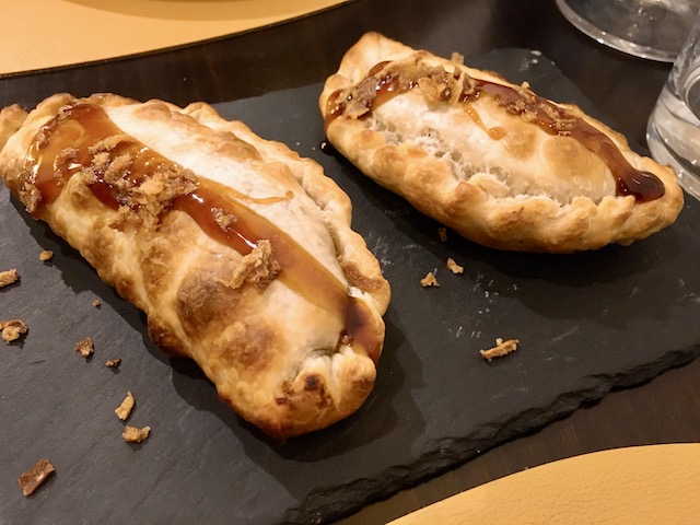 Fun de LLum tasting menu, cheddar cheese, spinach and crispy onion pies.