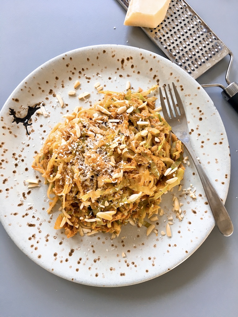 Tuna linguine cooked with shrimp paste and garnished with flaked almond.