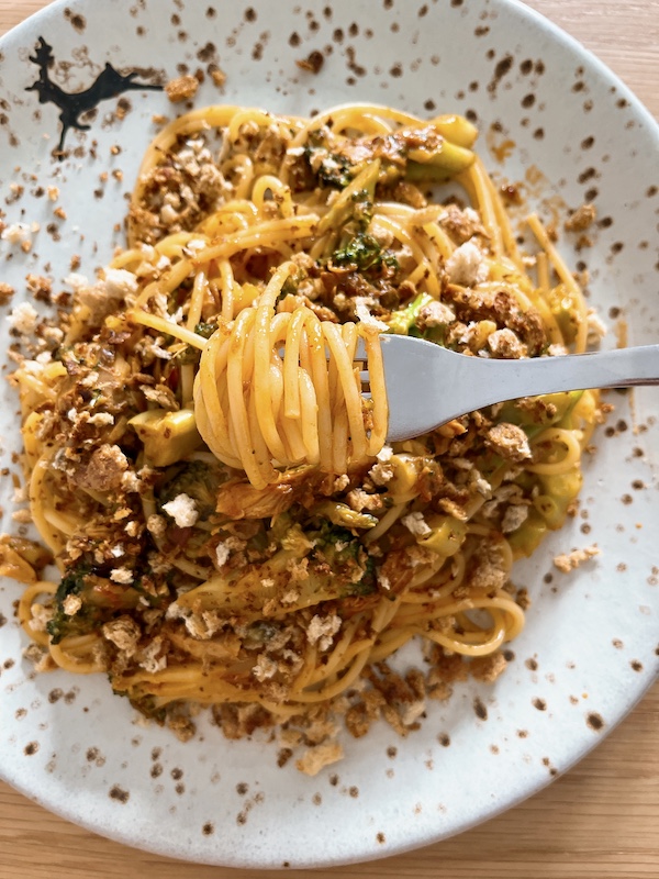 Speedy mackerel spaghetti with a fork.