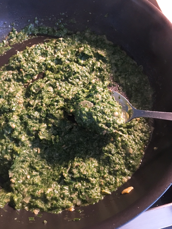 Making of spinach sauce.