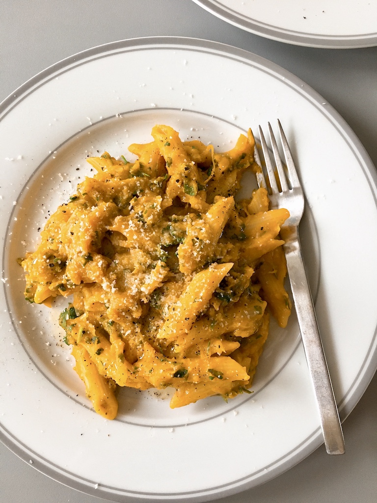 Pumpkin sauce penne with grated Parmasen.