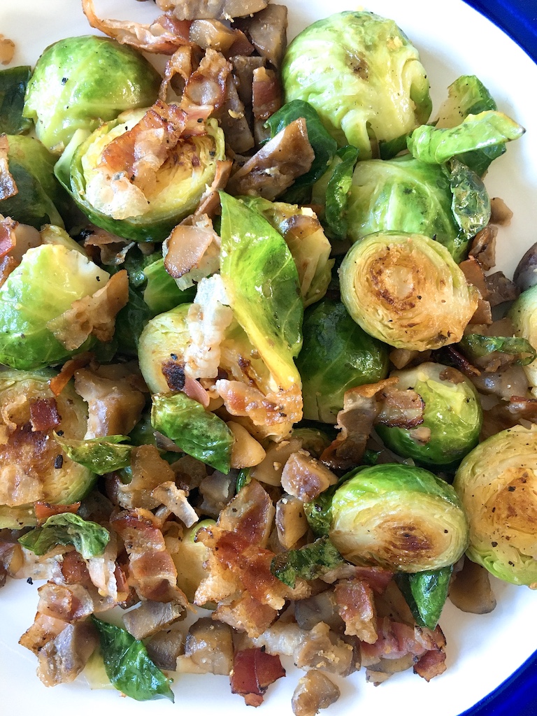 Browned Brussels sprouts with bacon and chestnuts.