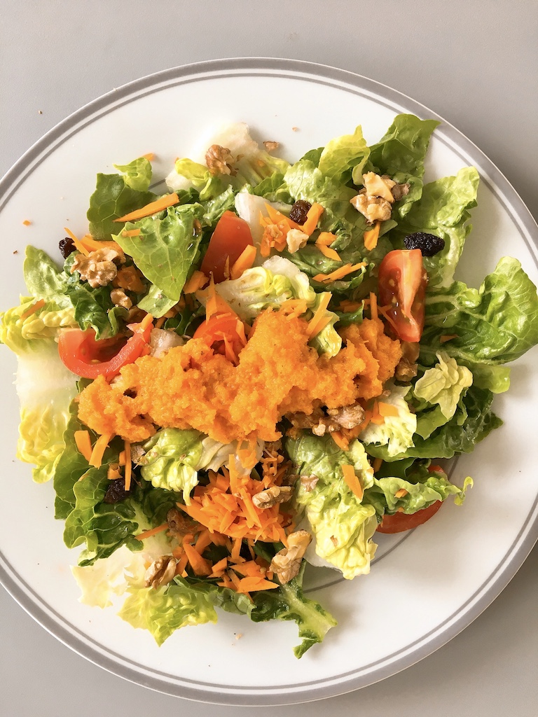 Romaine salad with carrot vinaigrette.