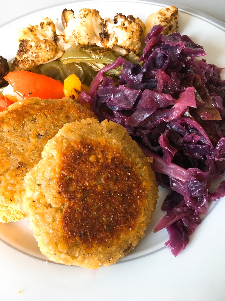 Spiced lentil patties with braised red cabbage and roasted veg.