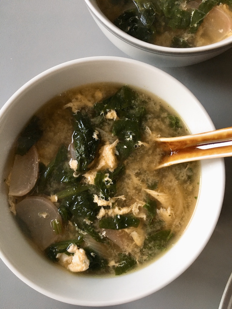 Japanese miso soup with spinach and radish.