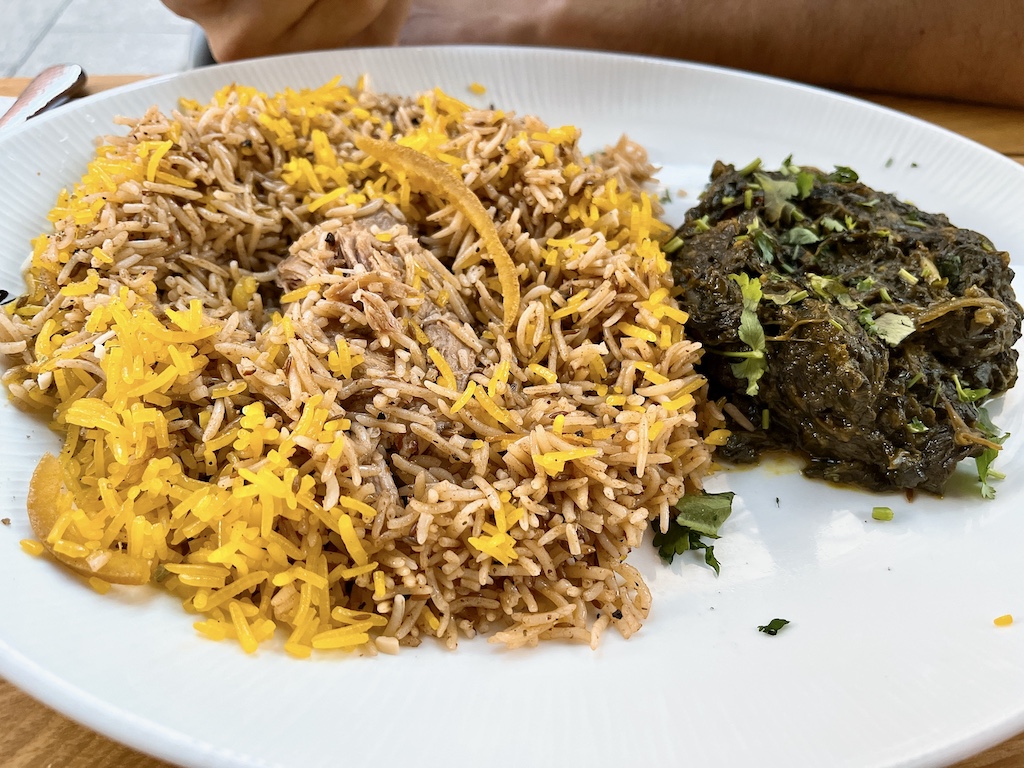 braised lamb with safron basmati rice and spinach.