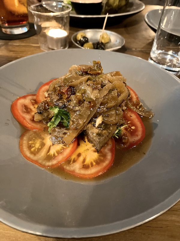 marinated mackerel with tomato and rucola.