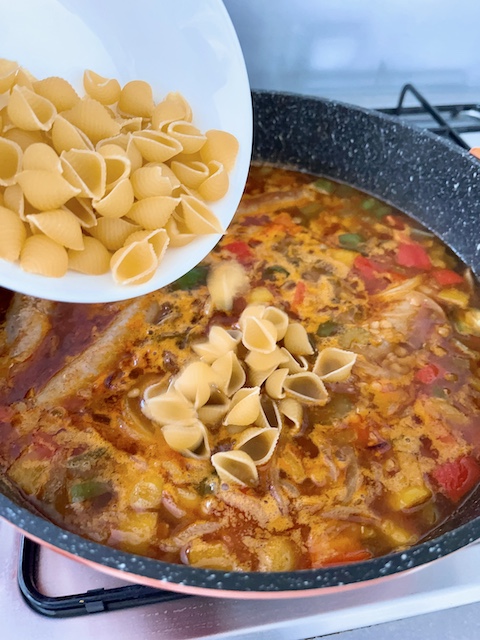 Stir in short pasta into the stew.