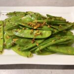 Stir-fry mangetout with garlic, cumin and turmeric