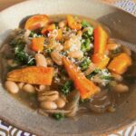 Vegan bean stew with roast squash and kale.