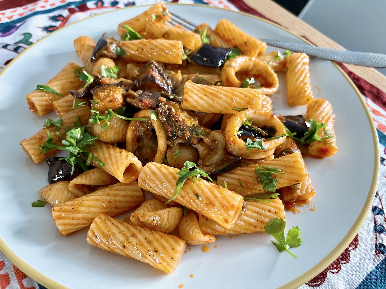 Confit squid with roasted aubergine and pasta.