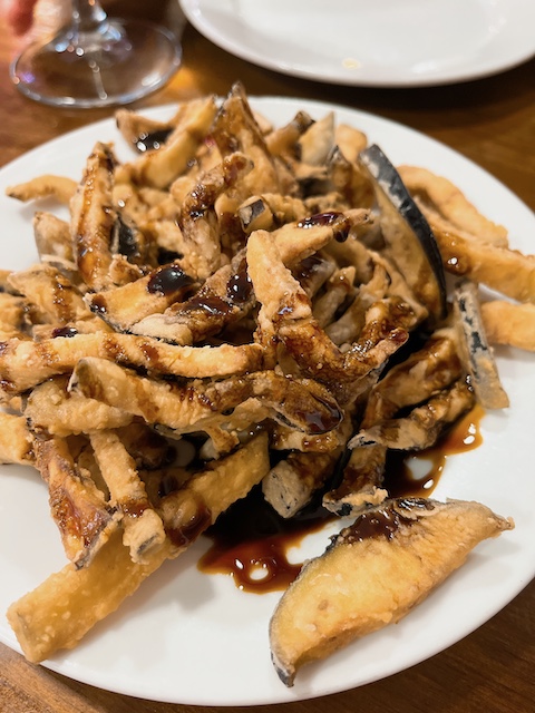 Fried aubergine with cane sugar sauce, a typical southern Spanish tapas.