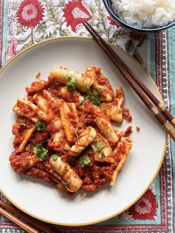 A plate of squid sambal with hot jasmine rice.