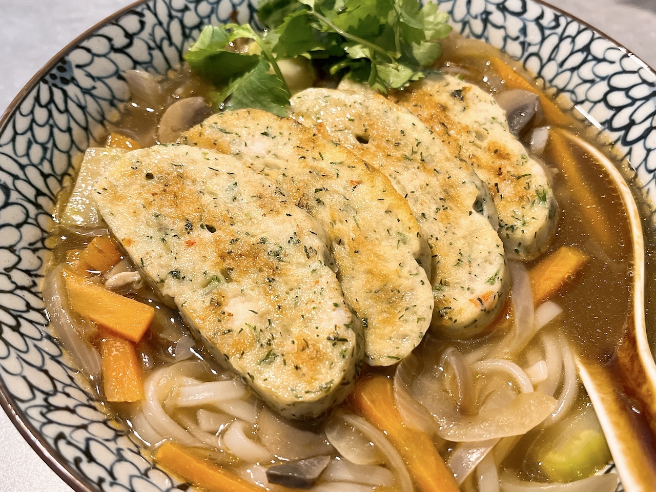 Vietnamese fishcakes with dill on soup noodles.