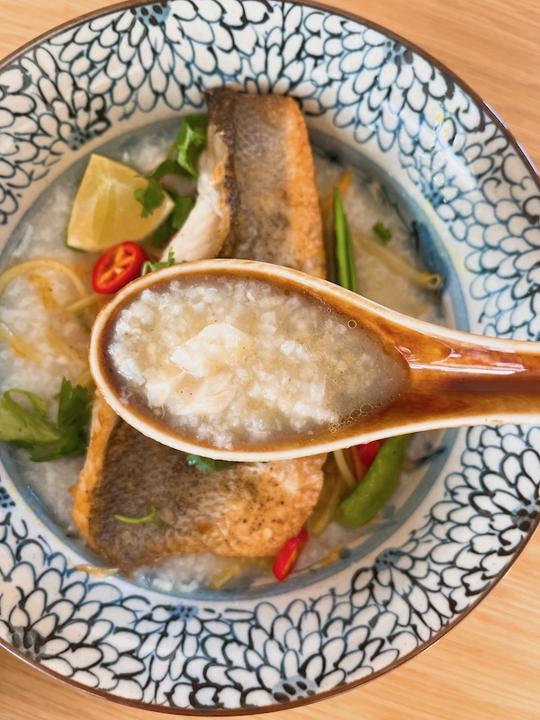 A spoonful of sea bass congee.