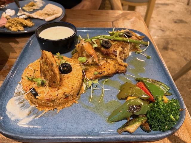 Grilled fish and spiced rice in a shopping mall's cafe.