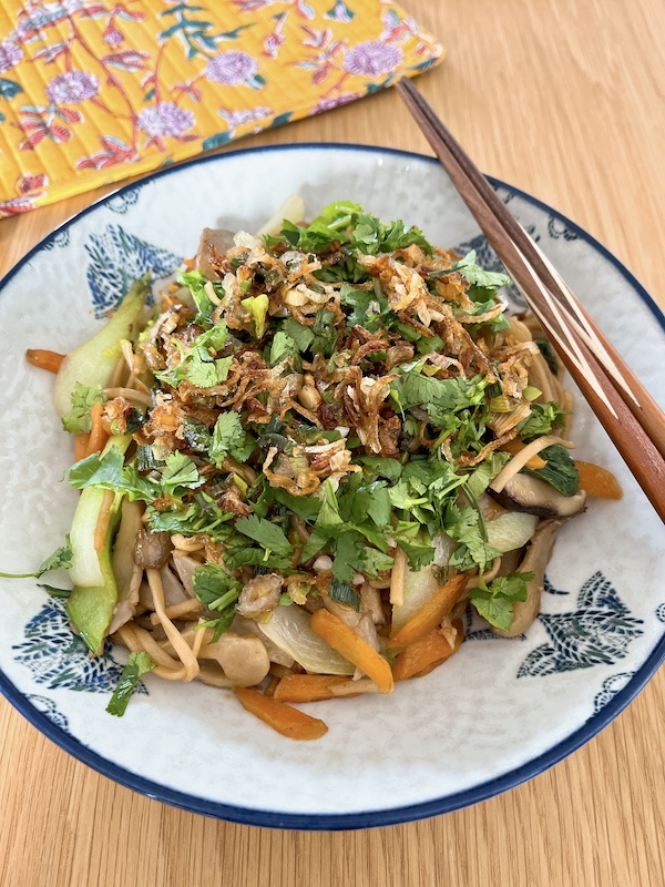 Mushrooms chow mein topped with crispy shallots.