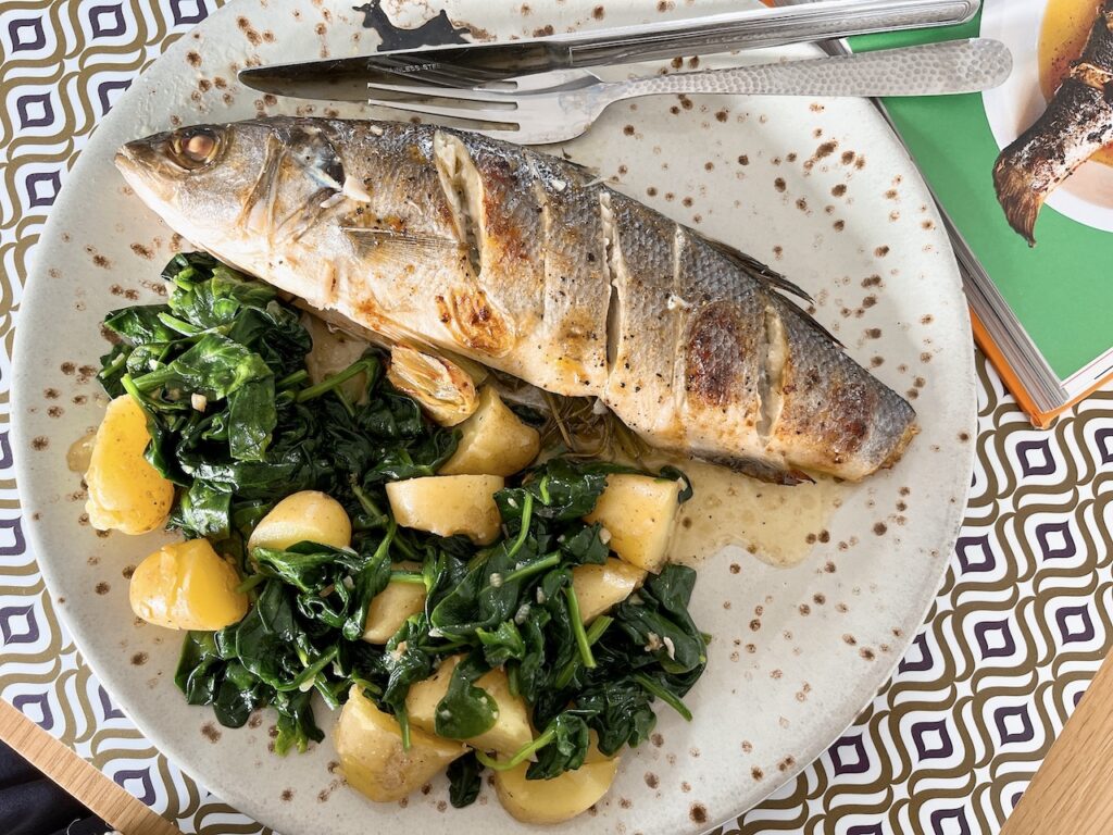 Baked whole sea bass with citrus butter.