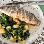 Baked whole sea bass with citrus butter.