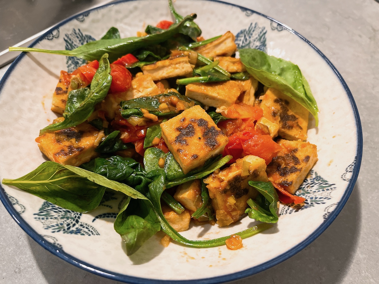 Tofu with spinach, tomato and basil.