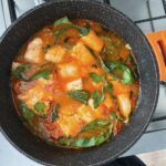 One pot meal: Poached fish in charred tomato broth.