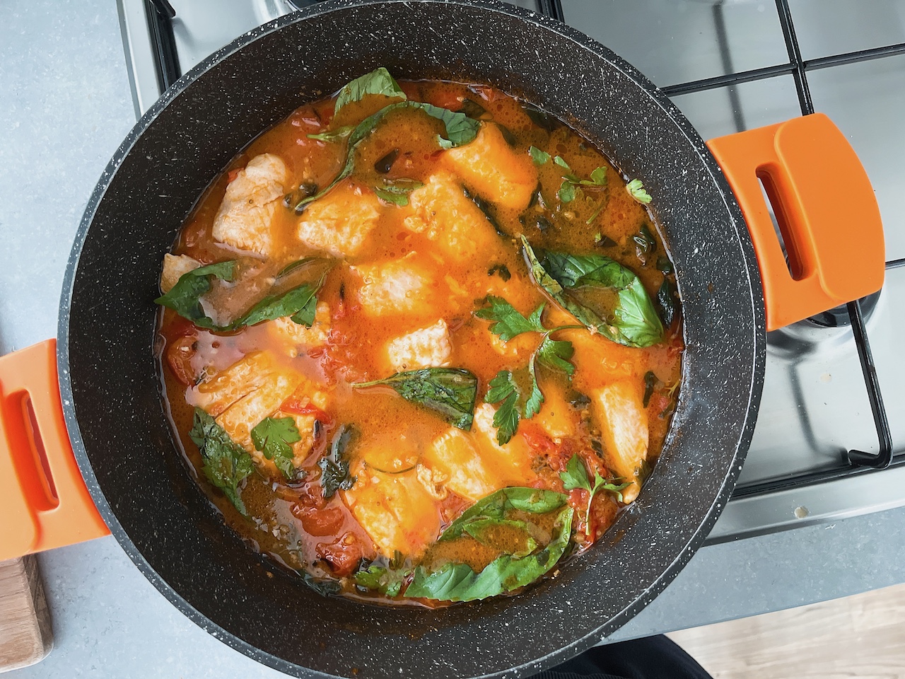 One pot meal: Poached fish in charred tomato broth.