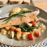 Pan-seared salmon with samphire and mussels velouté.