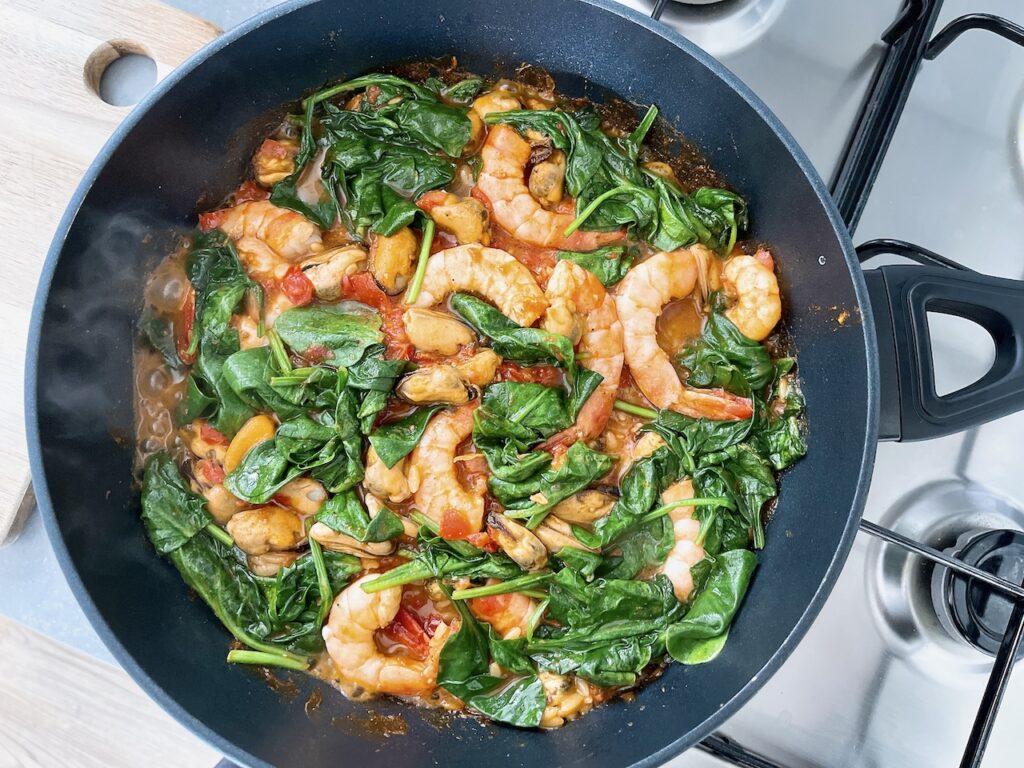 Spiced seafood over crispy orzo.