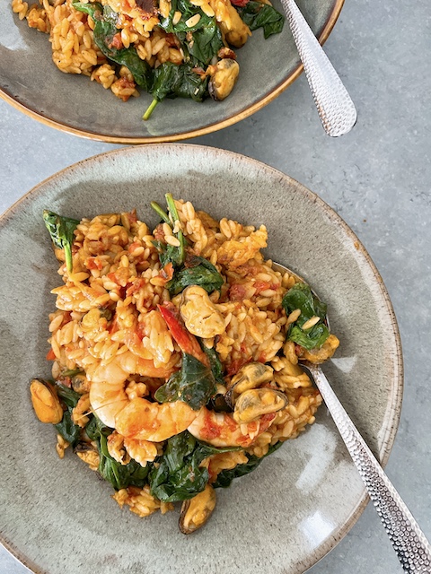 Orzo with spiced seafood.