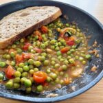 Sweet peas with caramelised onion and tomato.