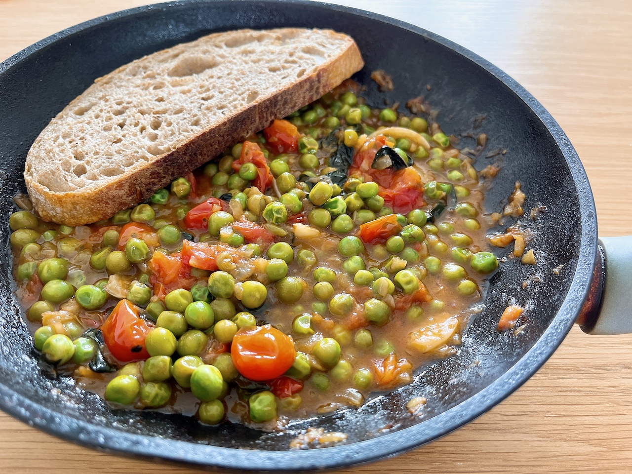 Sweet peas with caramelised onion and tomato.