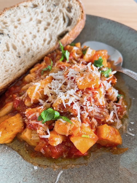 Celeriac and butter beans bouillabaisse with bread.