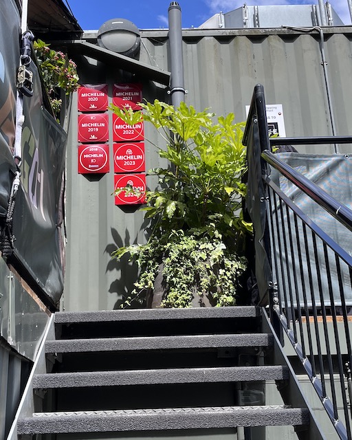 Red Michelin plates at the entrance.