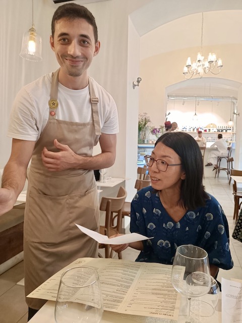 Hospitable server in restaurant Habibi, Rome.