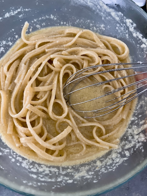 Making linguine with lemon and Parmesan.